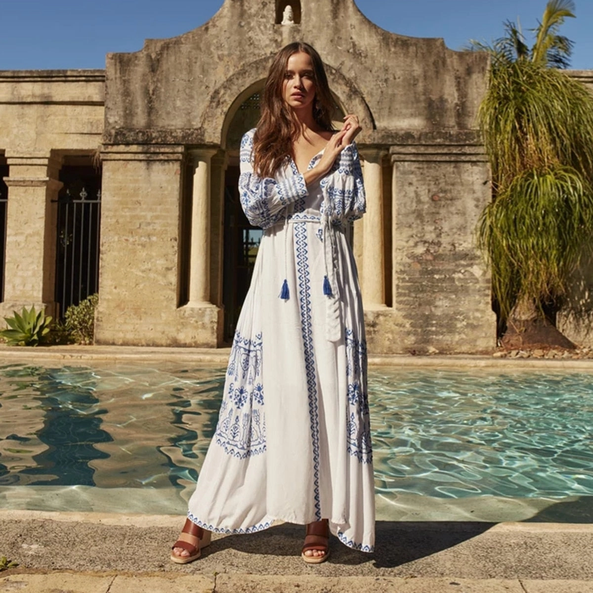 Bahia Maxi Dress White With Blue Embroidery Long Puffed Peasant Sleeves Embroidered Pockets Bohemian Tassel Ties Available In Small Medium Large Or XL Long Formal Maxi Dress
